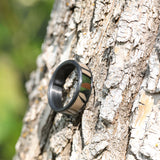 camo wedding ring with carbon fiber rails and sleeve on a tree