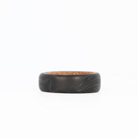 Forged Carbon Wedding Band with Whiskey Barrel Wood Interior Laying Flat