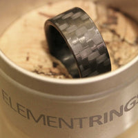 Carbon Fiber Ring In Its Container