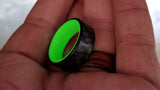 Yellow Glowing Resin Ring with Carbon Fiber in hand