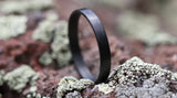 Carbon Fiber Stackable Ring in a forested environment