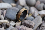 Men's whiskey barrel ring with carbon fiber in pebbles