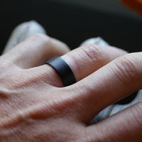Ultralight Men's Ring with Wave Carbon Fiber Worn On A FInger Close Up