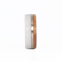 White Concrete Wedding Ring with Titanium Inlay and Whiskey Barrel Wood Front View