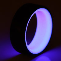 Purple Glow In The Dark Ring with Carbon Fiber glowing close up