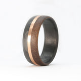 walnut wood and 14 karat rose gold wedding ring with carbon fiber sleeve