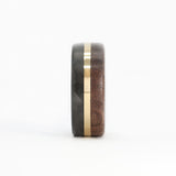 walnut wood and 14 karat yellow gold wedding ring with carbon fiber sleeve front view