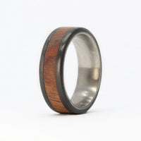 men's koa wood ring with carbon fiber rails and titanium sleeve