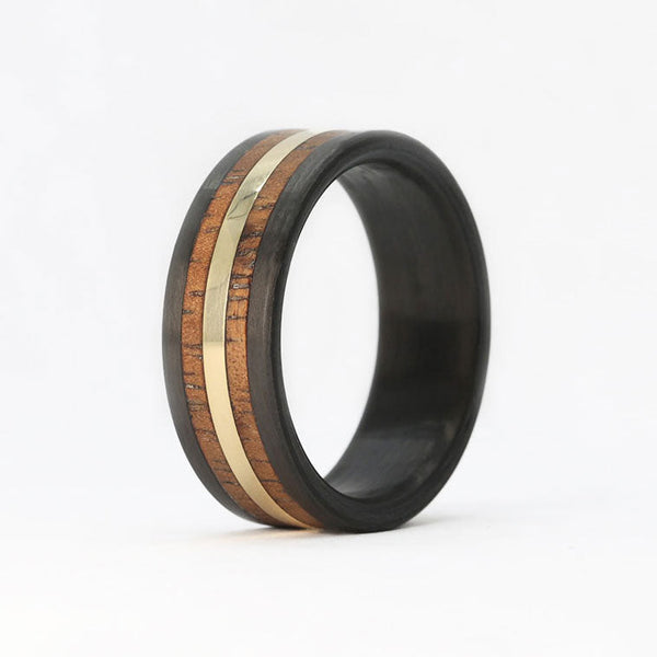 hawaiian koa wood ring with a gold inlay and carbon fiber sleeve
