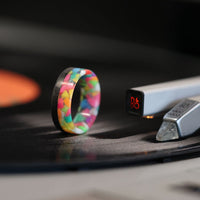pride glow in the dark ring with black carbon fiber rail on vinyl record player