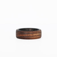 Zebra Wood Ring with Carbon Fiber Sleeve Laying Flat