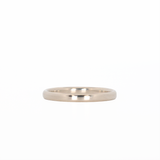 white gold stackable ring laying flat