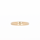 yellow gold stackable ring laying flat