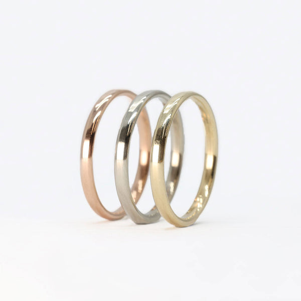 gold stackable rings set with rose gold, white gold, and yellow gold